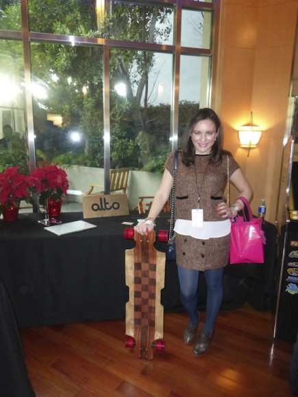 Posing with the Alto Skateboard at the GBK Celebrity Gifting Lounge American Music Awards Event - Wearing Lavand