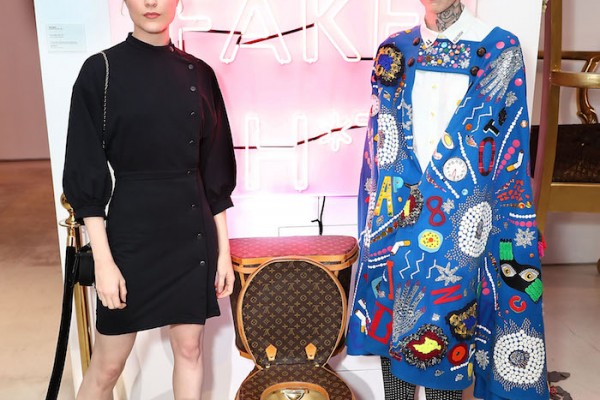 Evan Rachel Wood and artist Illma Gore pose next to Louis Vuitton Toilet in LA